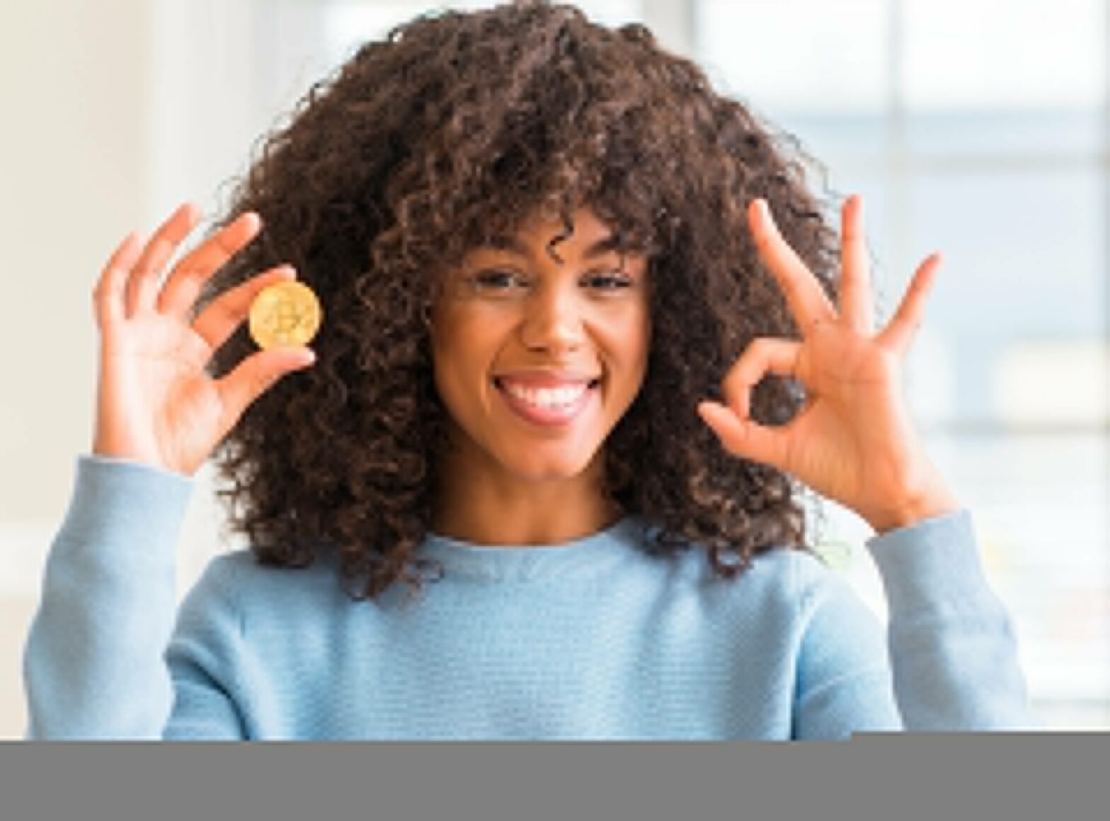Woman holding bitcoin cryptocurrency
